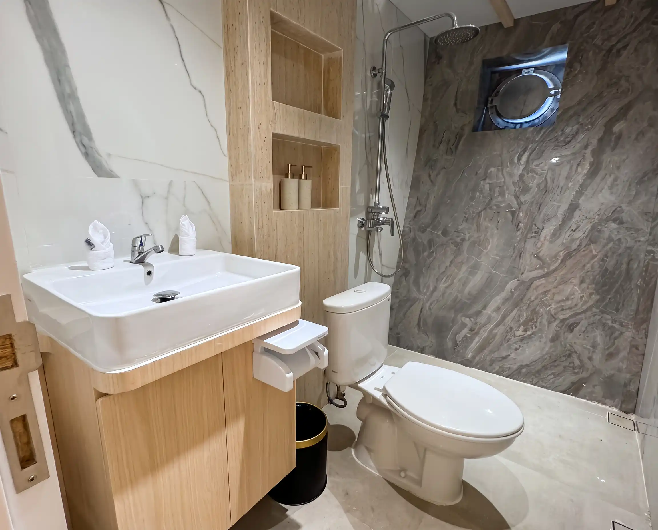 En-suite bathroom with walk-in shower aboard Lasha